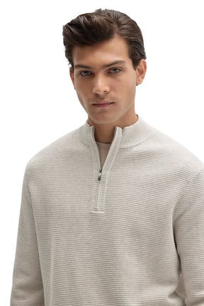 Men's close front detail of an off-white half-zip knit long-sleeve knit sweater with ribbed stand collar by Robert Barakett