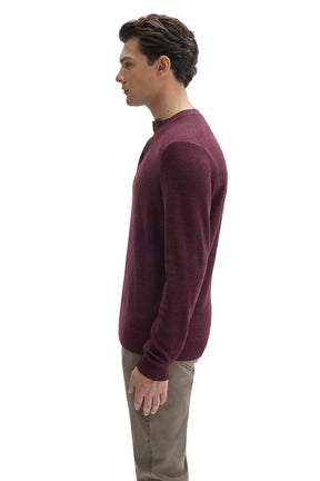 Side view of men's burgundy long sleeve henley knit sweater with ribbed cuff and hem by Robert Barakett