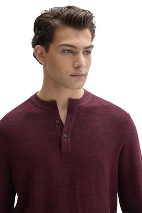 Close view of men's burgundy henley knit long-sleeve knit sweater neckline with black button placket by Robert Barakett