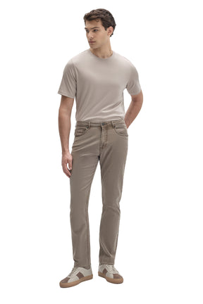 Men's full model front view of taupe gray slim straight-leg jeans with a washed finish shape by Robert Barakett