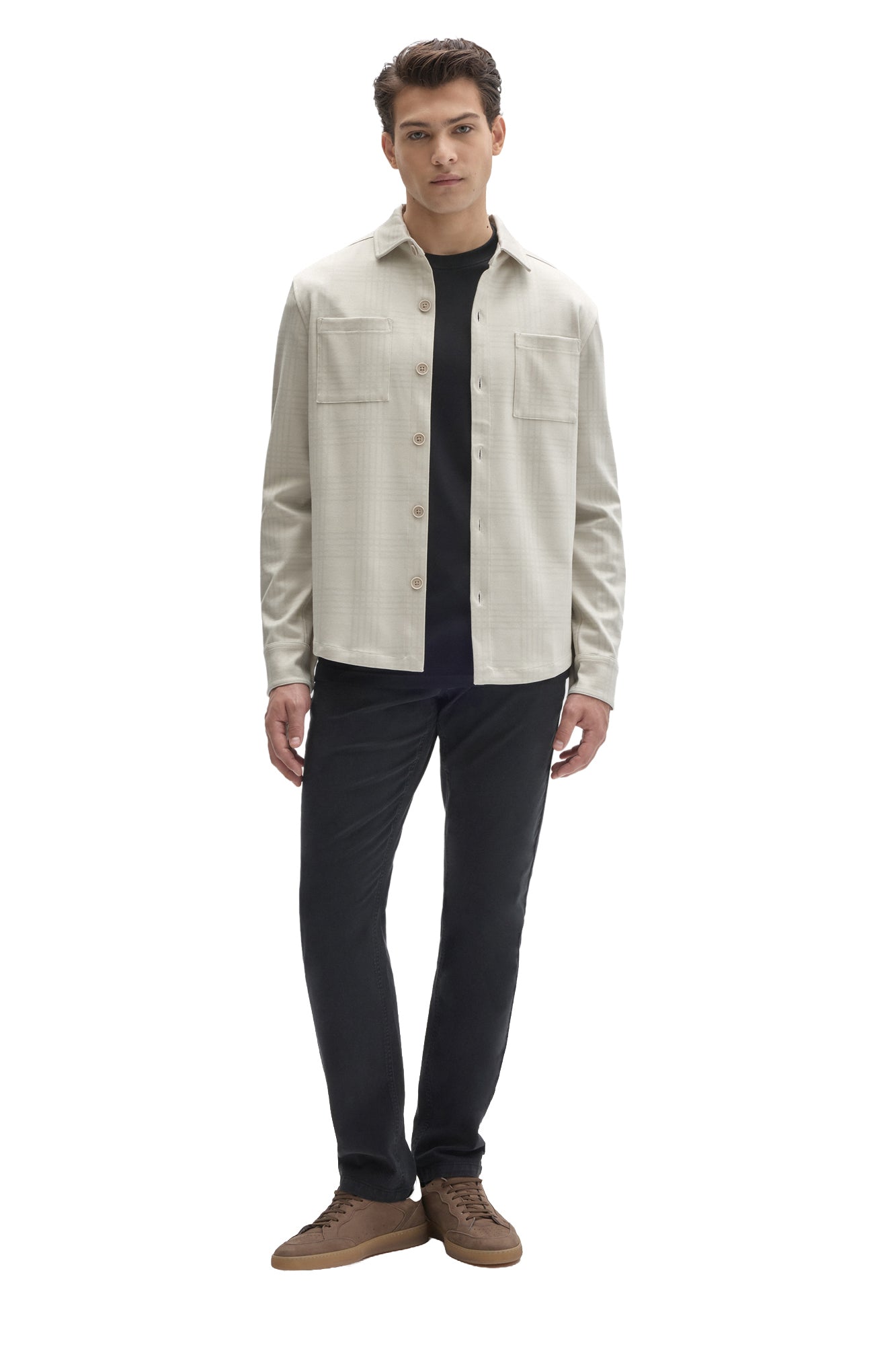 Men's full-body front view of cream tonal plaid overshirt worn open with button cuffs and chest pockets by Robert Barakett