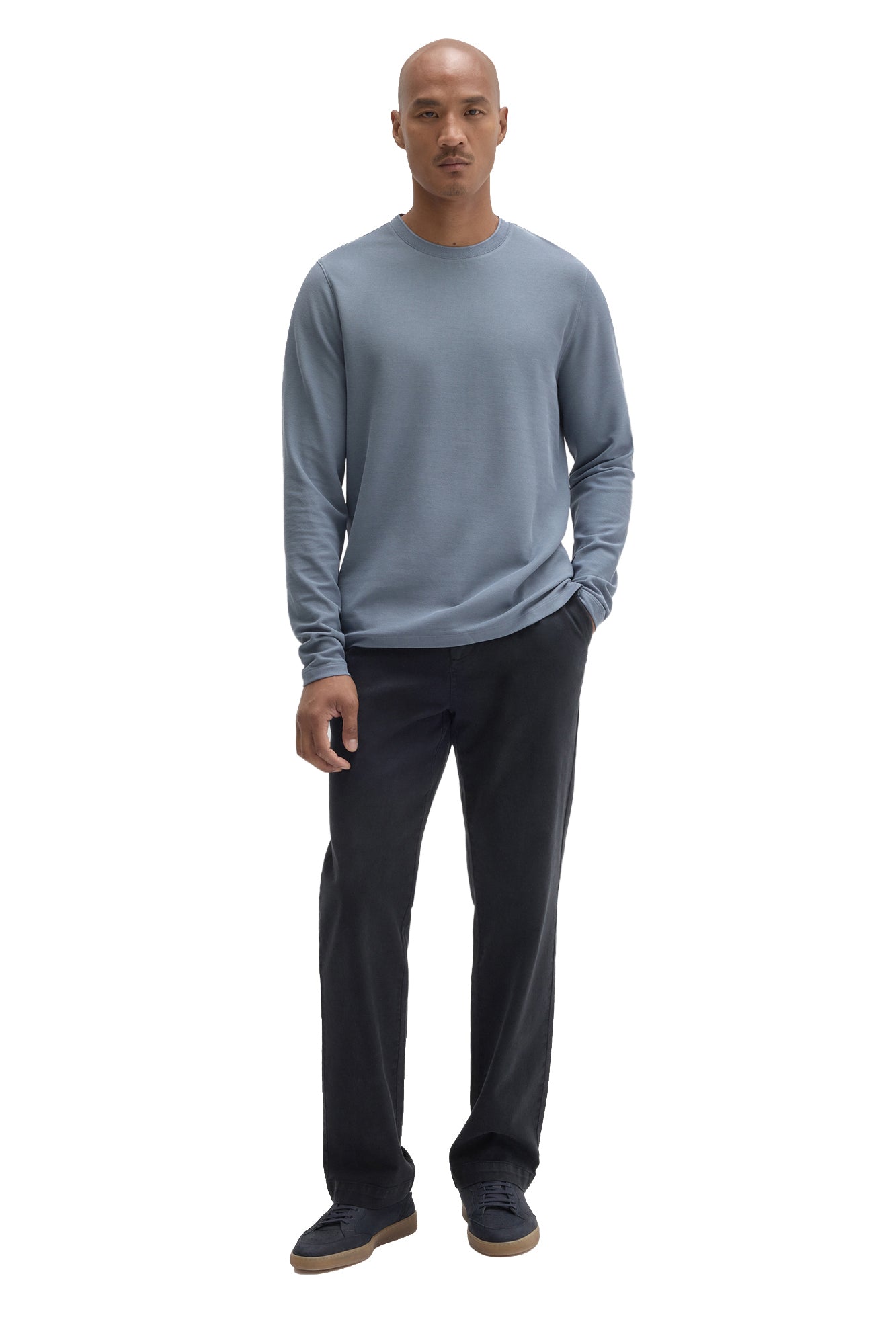 Men's full-length front view of blue-gray long sleeve crewneck T-Shirt styled with dark pants by Robert Barakett