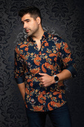 Au Noir men's navy button-up shirt with orange paisley floral print, front model view with rolled sleeves