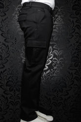 Au Noir men's black cargo pants with flap leg pocket, belt loops, and small back-pocket metal tag, side view