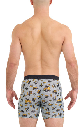 Saxx men's light blue ant and peanut print boxer briefs on model with black waistband, back view