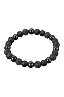Bracelet noir à billes rondes mates, lustrées et texturées poreuses sur fond blanc, vue produit pour homme par Au Noir